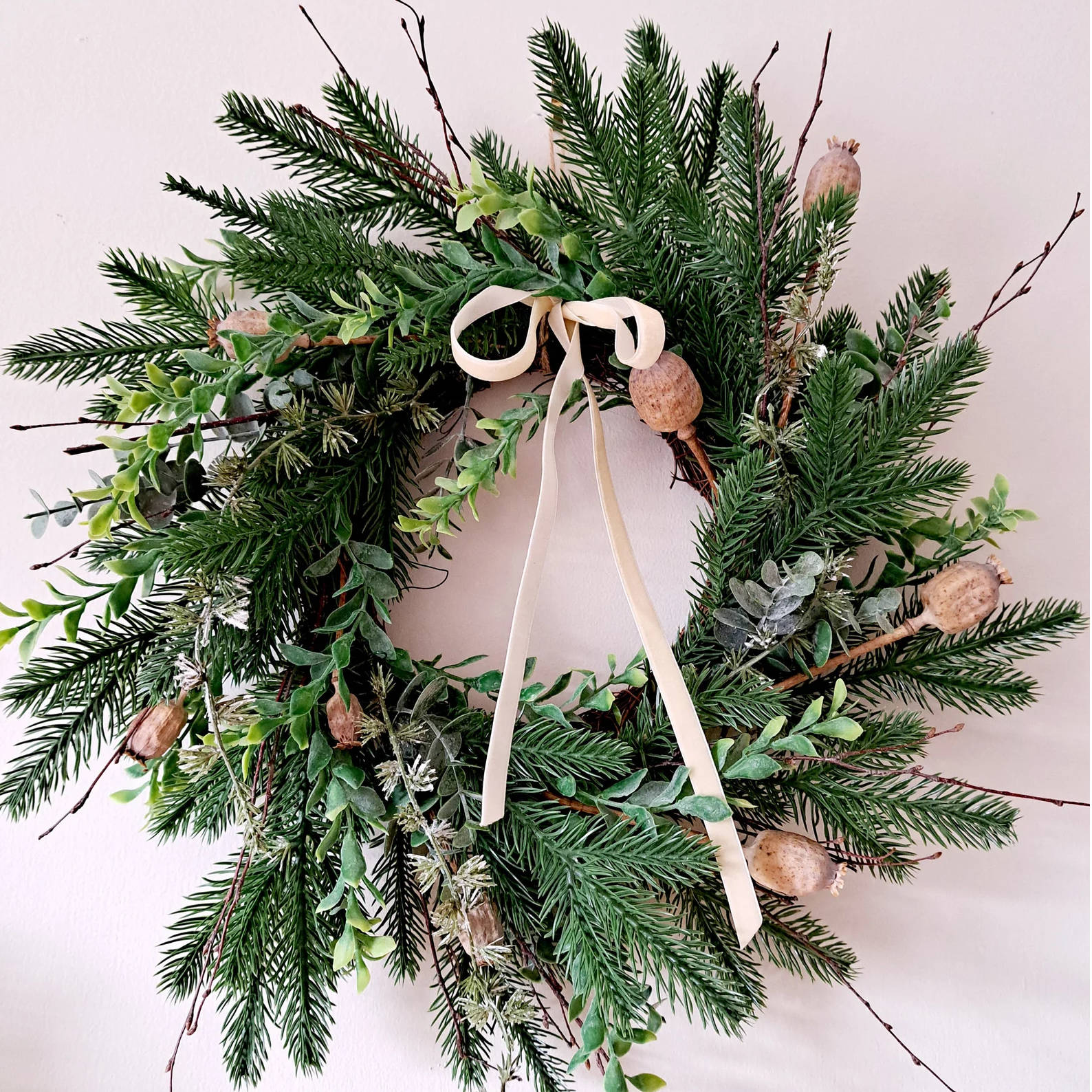 Winter wreath with ivory ribbon
